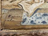 a close up of a painting of a cat on a bed