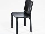 a black chair with a black leather seat on a white background