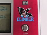 a red gameboy with a sticker on the screen