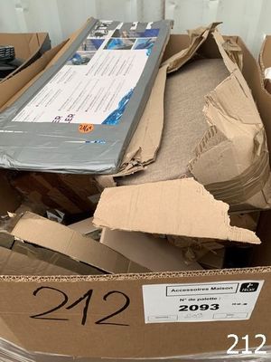 a cardboard box full of items that are sitting on top of a table