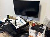 a desk with a computer and a monitor on it