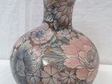 a vase that is sitting on a white table