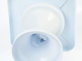 underside view of a white plastic container with a blue lid and a white plastic container with a blue lid and a white plastic container with a white lid
