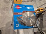 someone is using a circular saw to cut a piece of wood