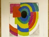a poster on the table with a picture of a colorful design