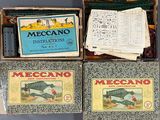 three boxes of mecano instructions and a box of mecano instructions