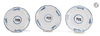 three blue and white plates with designs on them on a white surface