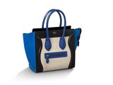 un sac à main bleu et noir sur fond blanc