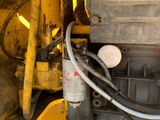 a close up of a machine with a hose attached to it