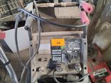 a machine that is sitting on the ground in the garage