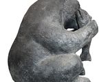 a statue of a bear that is sitting on the ground
