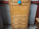 an image of a wooden cabinet with a blue tag on it