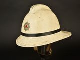 an old white fireman ' s hat with a star on it