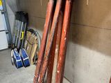 a pile of pipes in a garage next to a wall