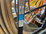 a close up of a bike tire with a sticker on it