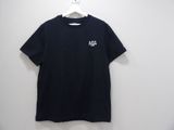 a black t - shirt hanging on a hanger against a white wall
