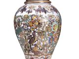 a vase with a bird and flowers design on it