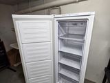 a refrigerator that is open and sitting in a room