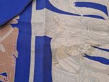 a blue scarf with a picture of a train on it