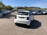 a white car that is parked in a parking lot