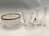 several pieces of glass and a bowl on a white surface