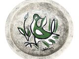 a plate with a bird painted on it on a white background