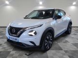 the white nissan suv is parked on a checkered floor