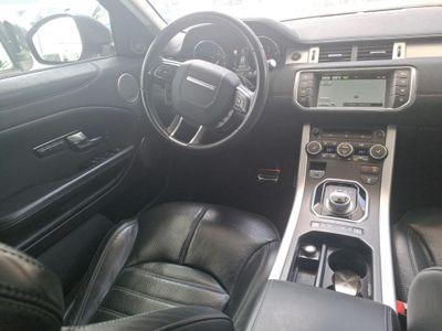 the interior of a car with a steering wheel, dashboard, and dash board