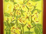 painting of yellow flowers in a red frame on a white wall
