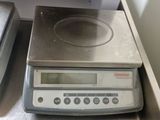 an image of a kitchen scale on a counter top