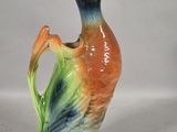 a ceramic duck that is sitting on a table
