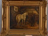a painting of two horses in a stable on a table