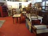 a room filled with lots of furniture and a red carpet