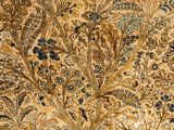 a close up of a rug with a floral design on it