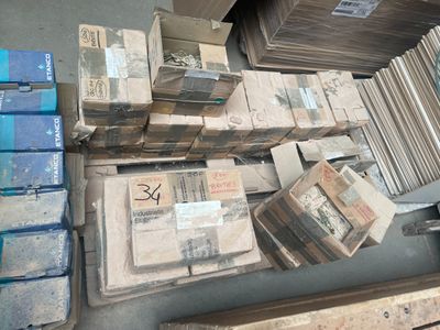 a lot of boxes and boxes of books on the floor