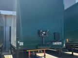 two trucks that are parked next to each other