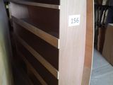 a wooden shelf with a number on it in a room