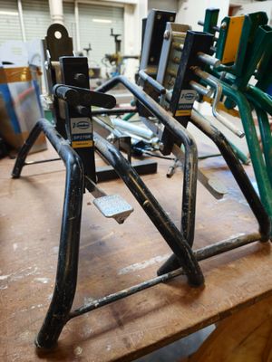 a wooden table with a bunch of bike racks on it