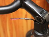 a close up view of a bicycle handlebar with wires