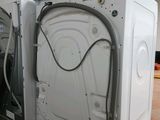 an image of a white washer and dryer inside of a building