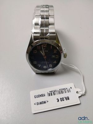 an image of a watch on a table with a price tag on it