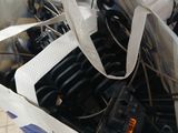 a white bag filled with assorted items on the floor