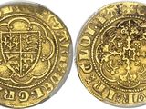 a gold coin with a coat of arms on it