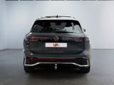 the rear end of a black vw tiguan parked in a garage