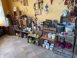 a room with a lot of different items on the shelves