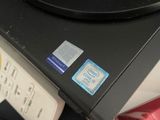 an image of a laptop and other electronics on a table