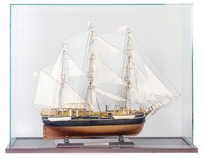a small model of a ship in a glass case