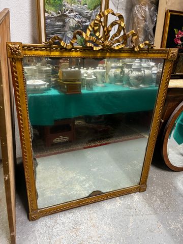 Miroir cadre bois et stuc doré, décor de nœud.133 x 96 cm