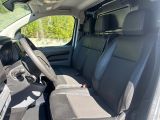 the interior of a car with two rows of seats and a steering wheel
