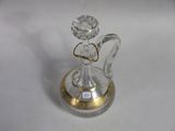a glass angel figurine with a diamond on it